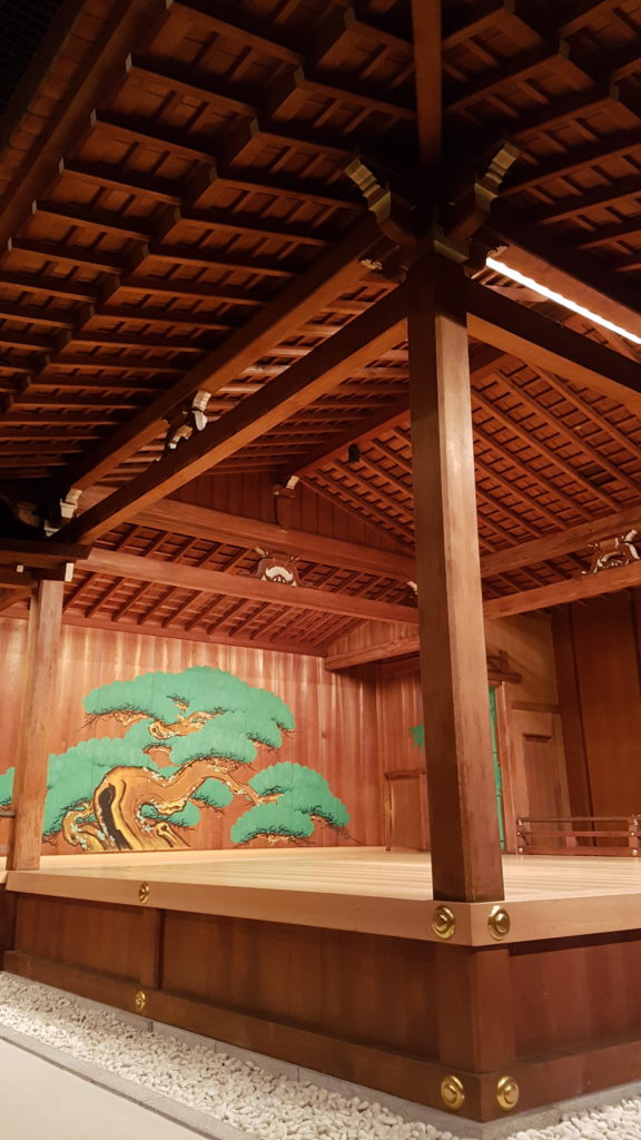 A ground level view looking up towards the noh stage from the "eye-fixing" pillar