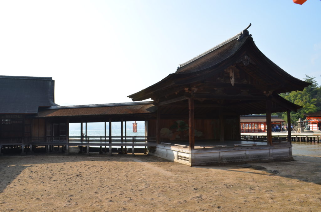 A roof covers the bridgeway and the mainstage of the outdoor nogaku stage at Itsukushima Shrine